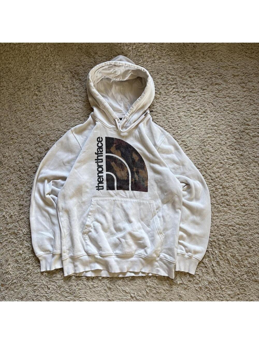 The North Face white hoodie with camouflage logo